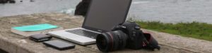 laptop book and camera